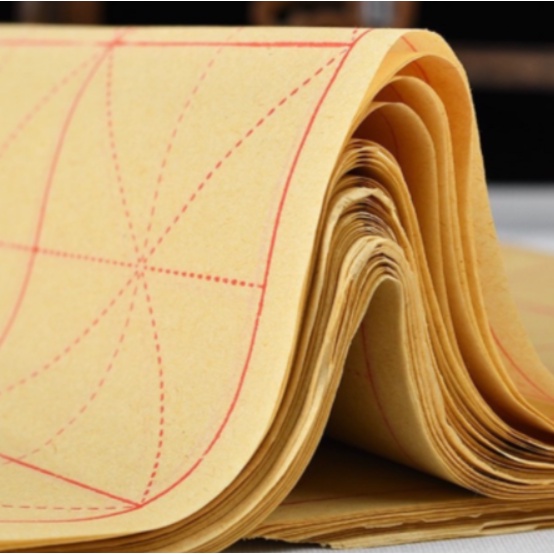 Tập giấy tập viết thư pháp kẻ ô mễ 50 tờ màu vàng NHT Books