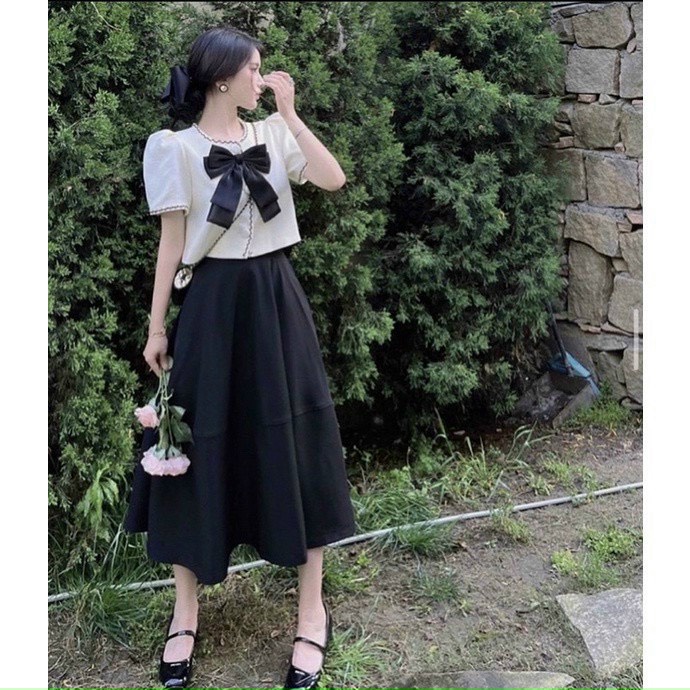Set áo viền đính nơ kèm chân váy xòe màu đen Lovishop93