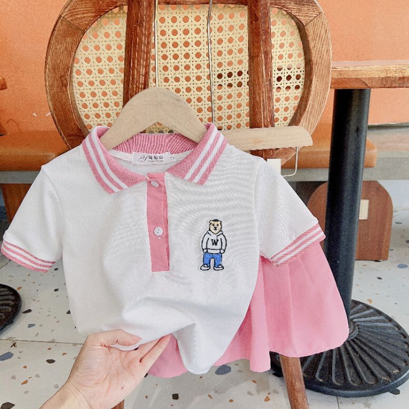 Set áo polo kèm chân váy thô bé gái