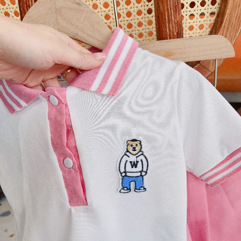 Set áo polo kèm chân váy thô bé gái