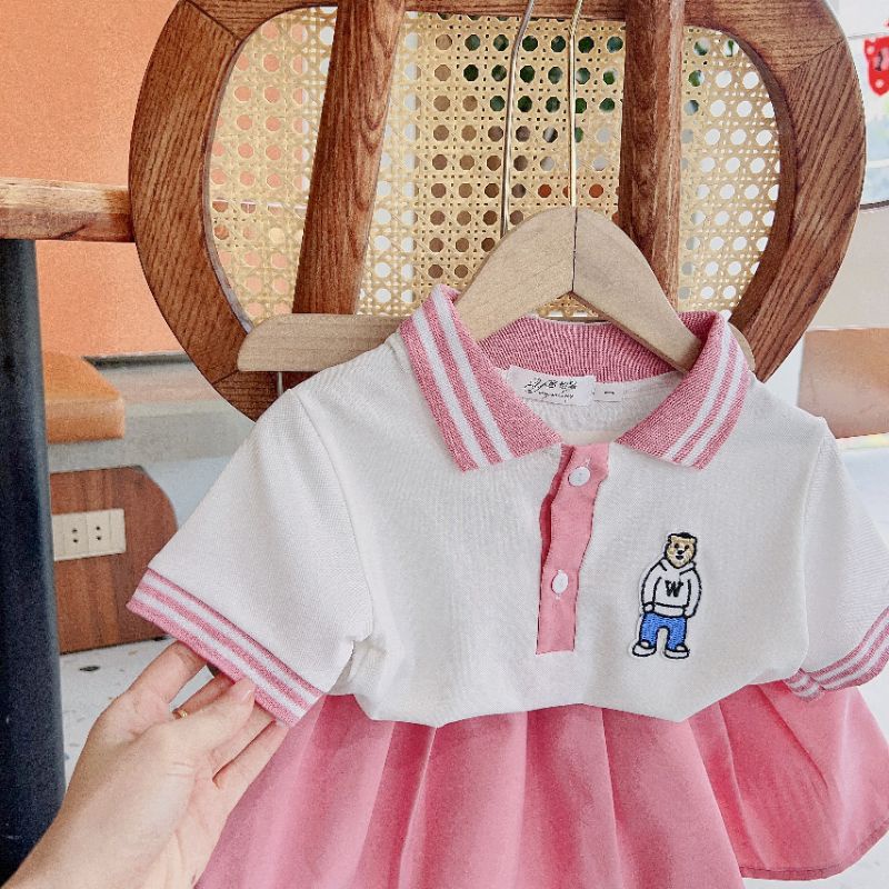 Set áo polo kèm chân váy thô bé gái