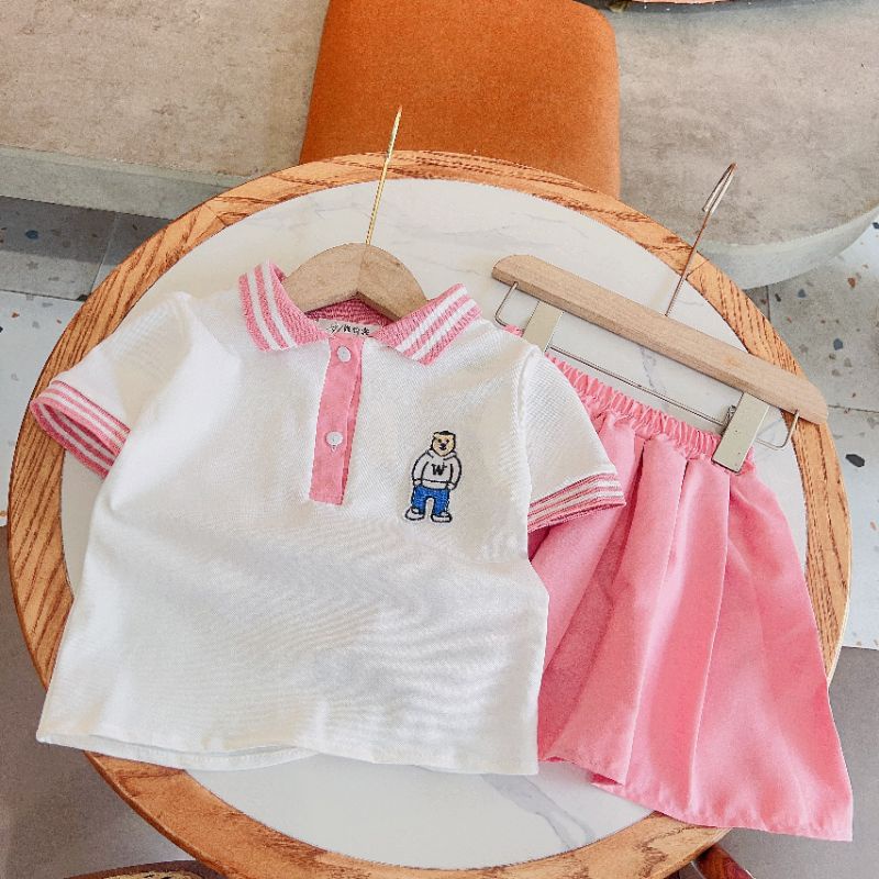 Set áo polo kèm chân váy thô bé gái