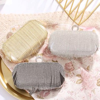 Túi clutch đính đá tua rua