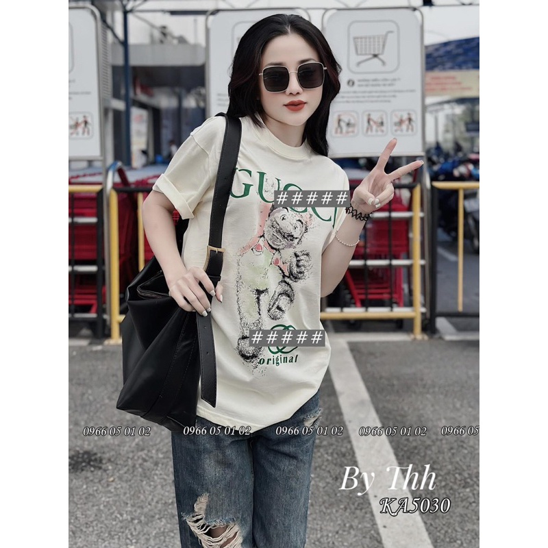 ÁO PHÔNG BE CHỮ XANH GUSI HÌNH CHÚ HỀ MẪU HOT