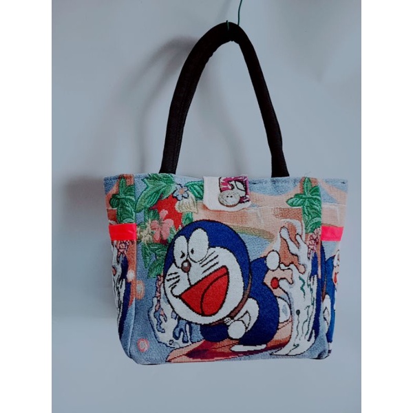 Túi làn khoá cúc dừa size 18*25cm