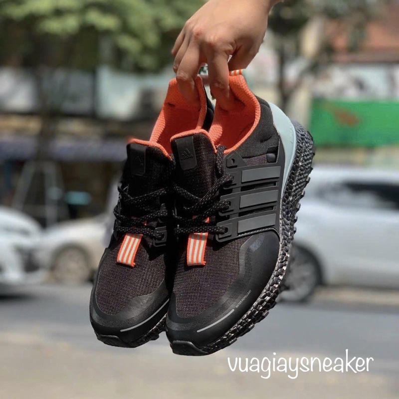 Giày sneaker ultraboost TRIP đen lòng cam