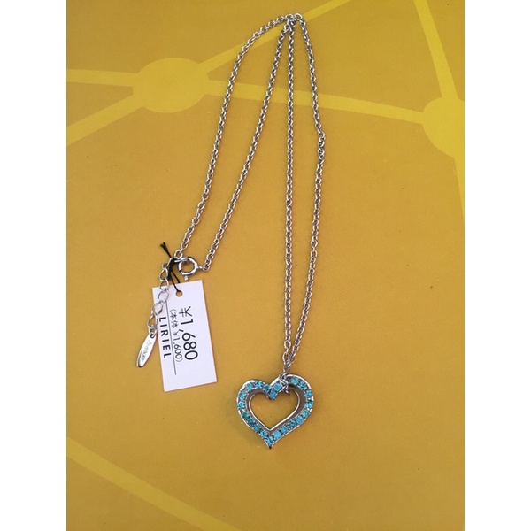Dây chuyền hiệu Melody mặt tim đính full đá xanh