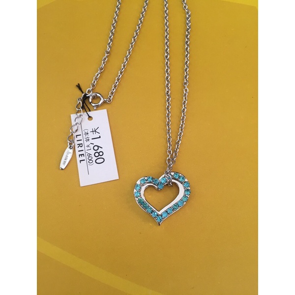 Dây chuyền hiệu Melody mặt tim đính full đá xanh
