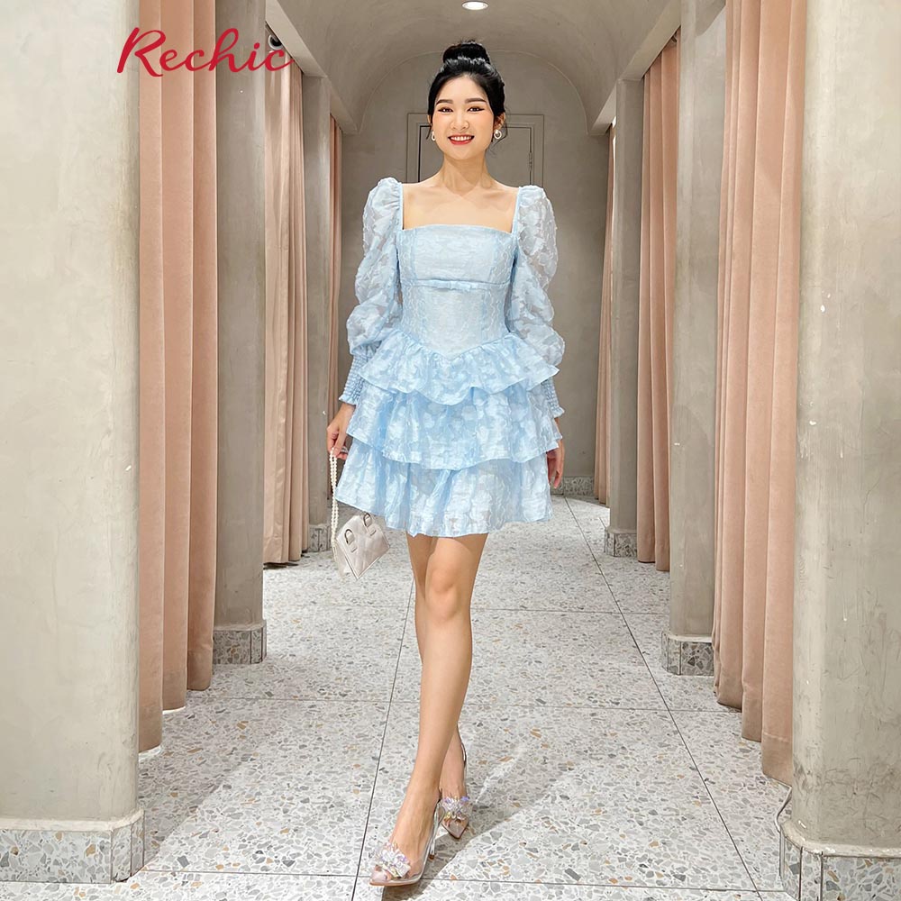 RECHIC Đầm nữ Melisa cổ vuông tay bồng đính nơ ngực dáng chữ A xếp tầng tiểu thư sang trọng
