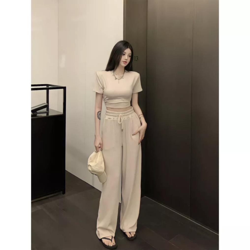 Set Áo Thun Croptop Cộc Tay Nữ Khoét Lưng Kèm Quần Culottes Dài Ống Rộng Vải Gân Xốp 3 Màu