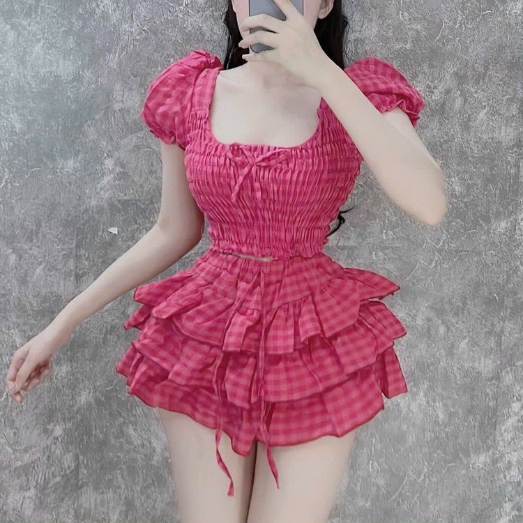 Set đồ bộ áo croptop nhún tay phồng đính nơ, chất đũi xốp kèm chân váy tầng họa tiết caro dễ thương