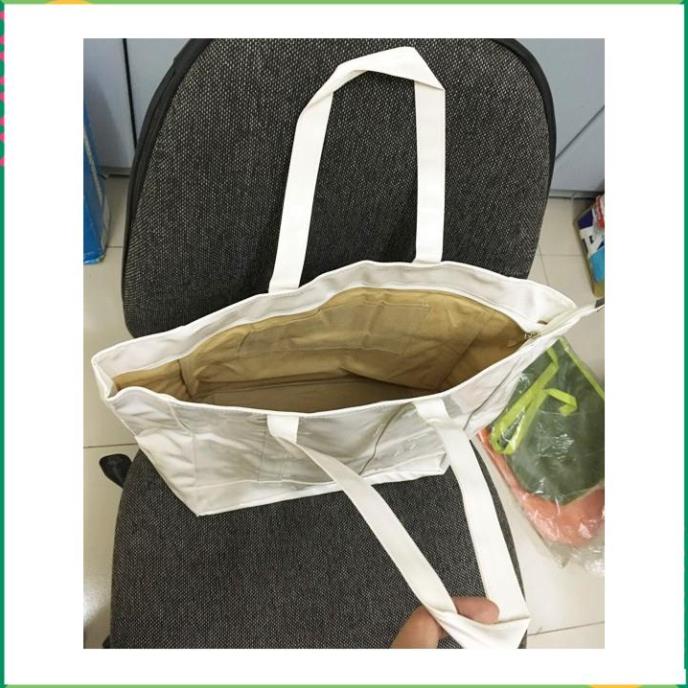 Túi xách simili bóng dây kéo 43x28x15cm màu trắng sữa hay cam .