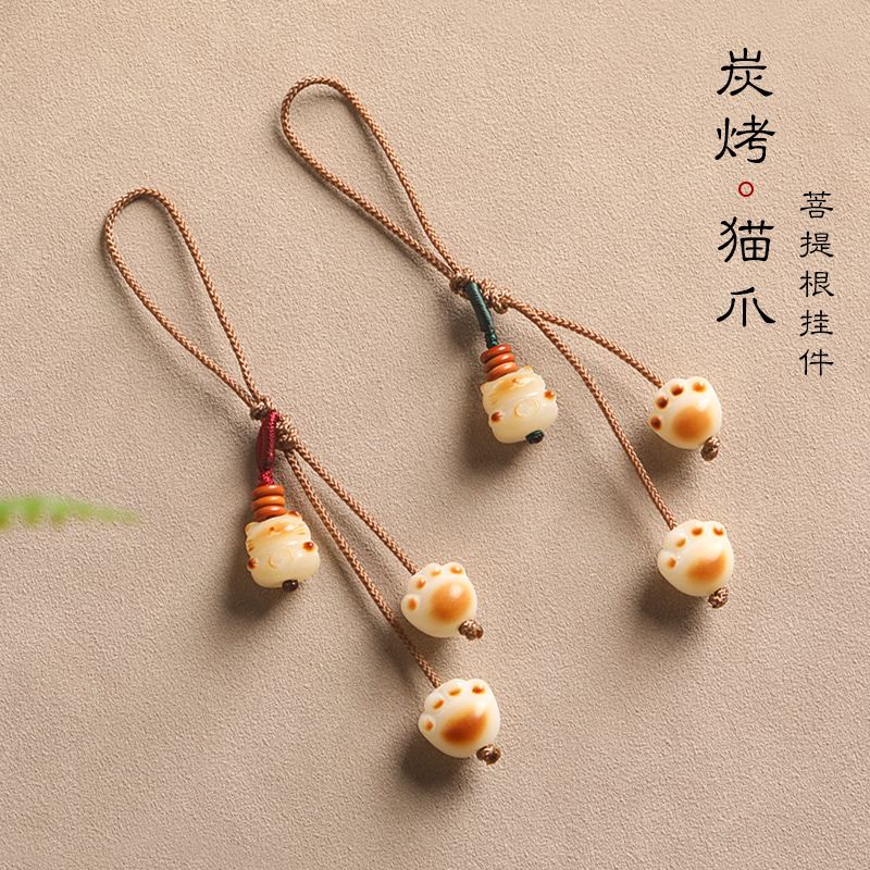 Móc Điện Thoại Hình Bàn Chân Mèo Bằng Than Hoạt Tính Dễ Thương