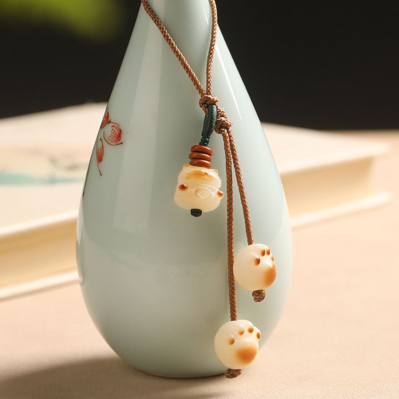 Móc Điện Thoại Hình Bàn Chân Mèo Bằng Than Hoạt Tính Dễ Thương