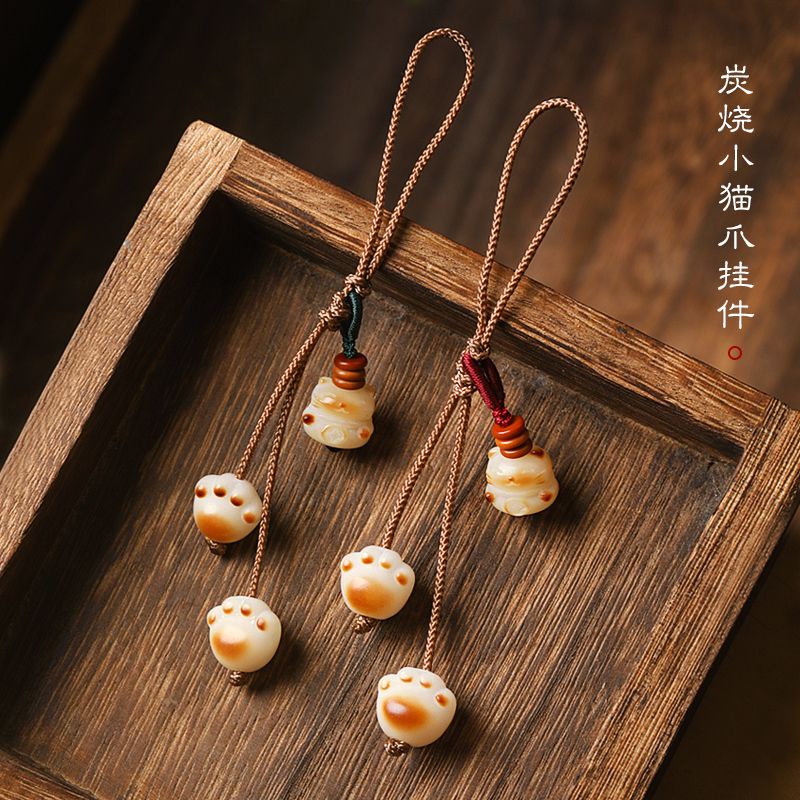 Móc Điện Thoại Hình Bàn Chân Mèo Bằng Than Hoạt Tính Dễ Thương