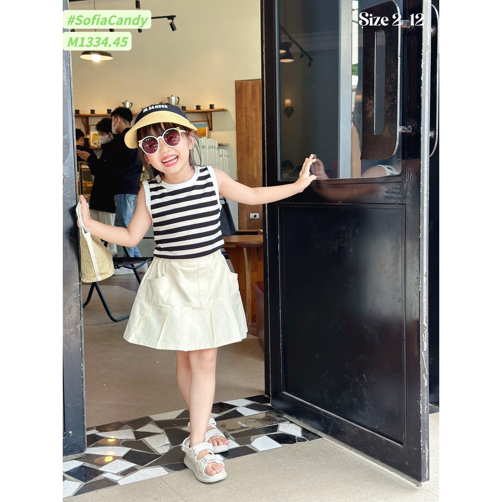 Bộ Mia Kids áo thun croptop kẻ sát nách - chân váy kaki liền quần màu kem size 2 - 12y