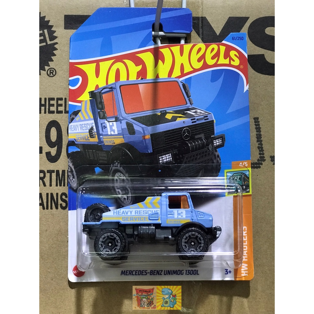 Tanoshii Shop - mô hình xe 1:64 Hot Wheels HKJ99 MERCEDESBENZ UNIMOG 1300L