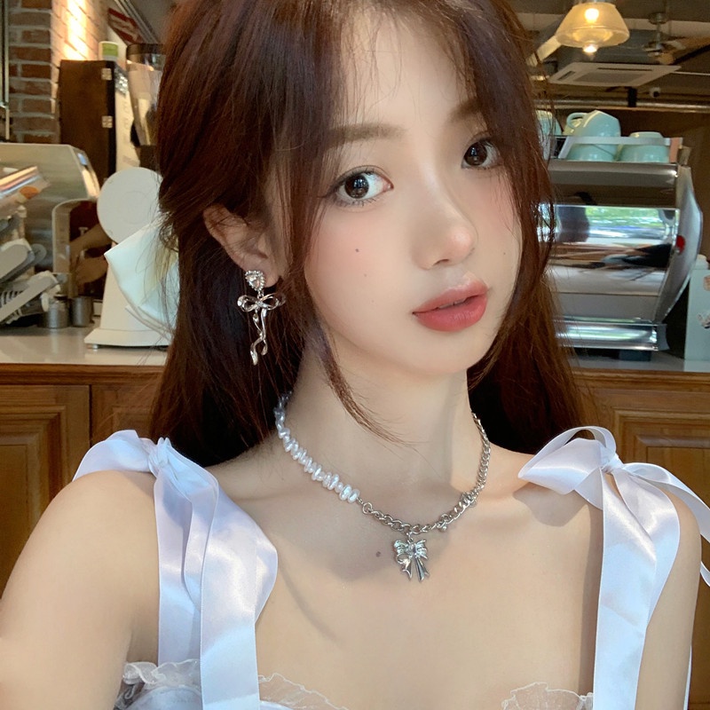 Khuyên tai kẹp không bấm lỗ chốt cố định K366 bằng hợp kim mạ bạc hình trái tim gắn nơ dáng dài bigsize Leous