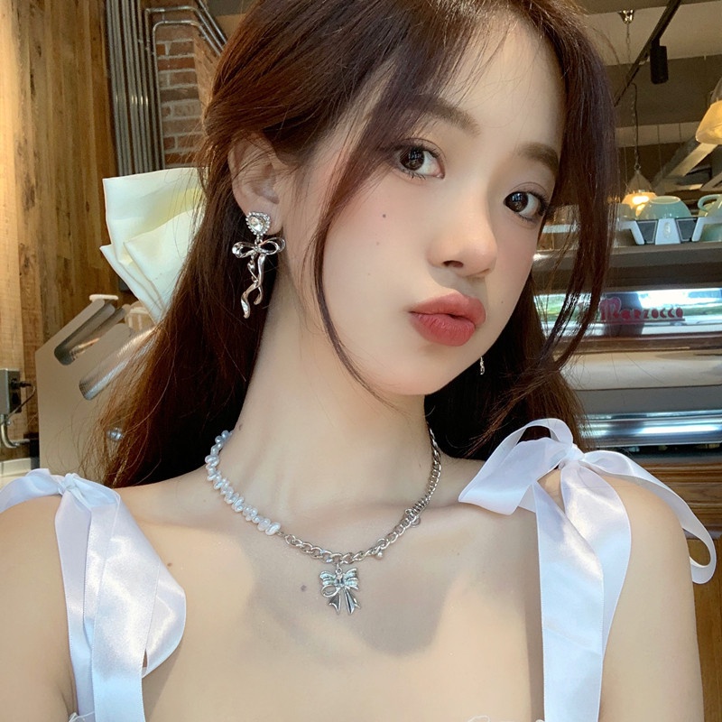 Khuyên tai kẹp không bấm lỗ chốt cố định K366 bằng hợp kim mạ bạc hình trái tim gắn nơ dáng dài bigsize Leous