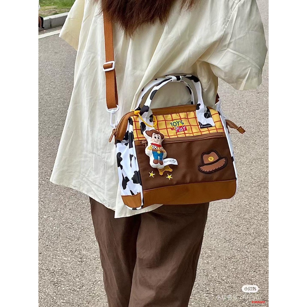 Trong khoﺴMàu sắc tương phản phim hoạt hình xách tay Messenger túi đeo vai sức chứa lớn cho sinh viên mới