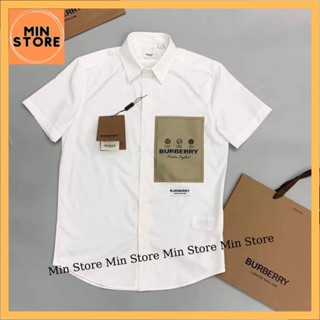 Áo Sơ Mi Trắng Nam Nữ Burberry Cộc Tay In Mác Logo BBR Nâu Ngực Chất Vải Lụa Hàng Siêu Cấp Dành Cho Các Boy Phố Đi Chơi