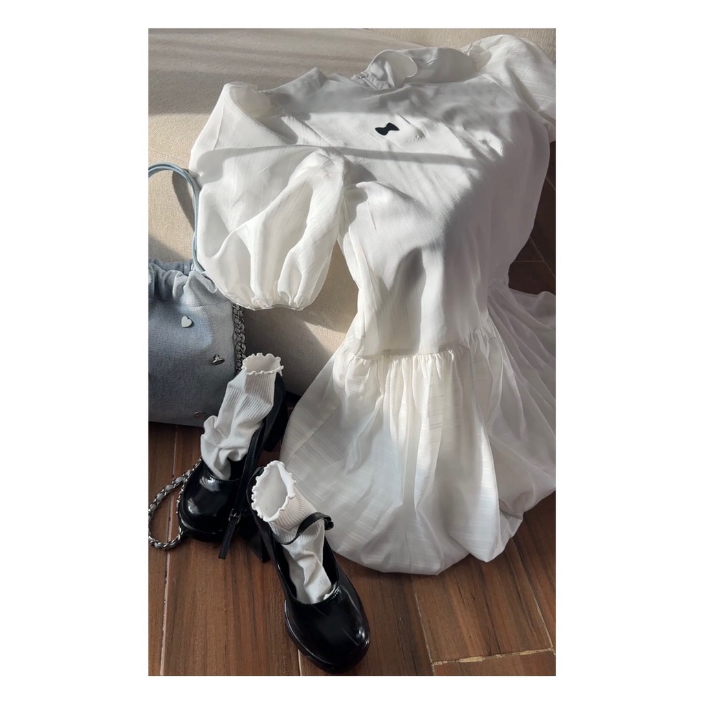 Jeny dress váy bèo nhún tay bo chun in nơ dập nổi AGUJA