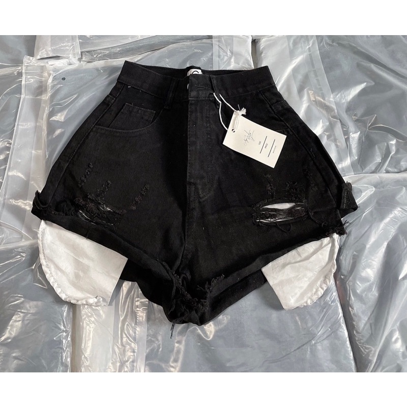 Quần đùi jean rách túi lồi