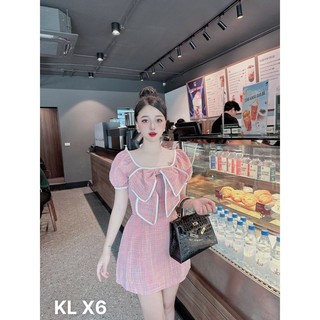 Đầm đũi nhún nơ viền