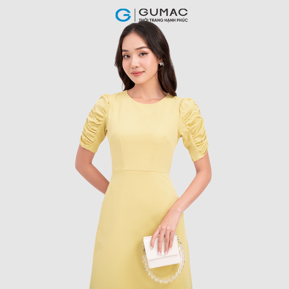 Đầm nữ thời trang GUMAC màu vàng dáng chữ A phối tay nhún DC07050