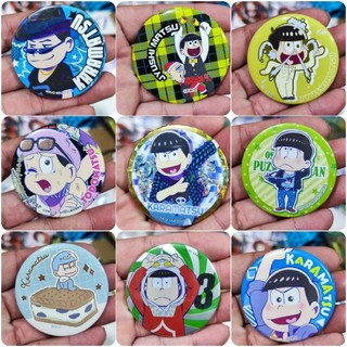 Móc khóa + huy hiệu nhân vật anime.