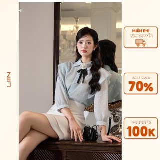 Áo Nữ Phong Cách Tiểu Thư Phối Hoa Cài Vải Tơ Xanh Blue Tay Lỡ Phối Bèo Liin Clothing SML409SBL-S24