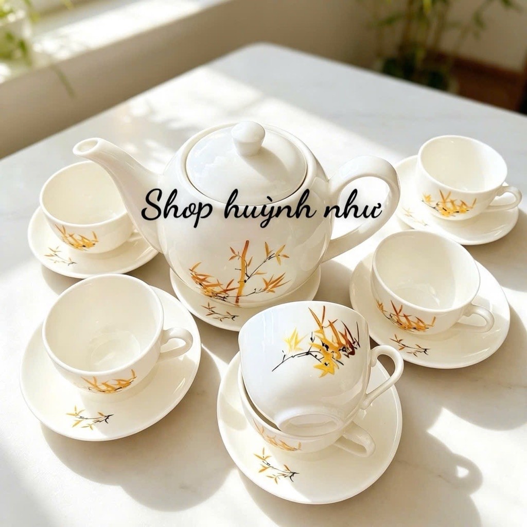 [SHOP 3K MARTS II]Bộ ấm trà hình hoa sen đẹp1 Bộ gồm 1 ấm trà , 6 ly kèm 7 cái đĩa lót . Sứ tráng me