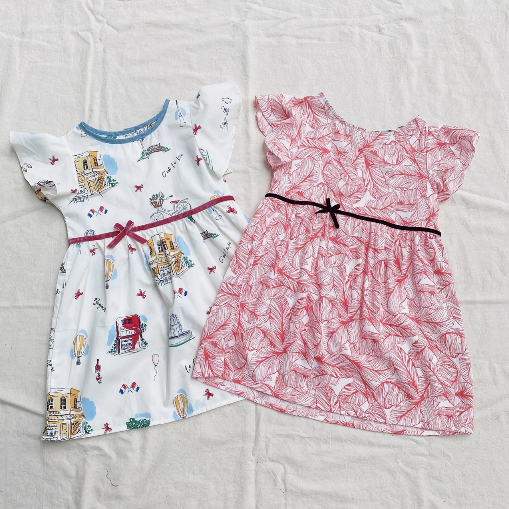 Đầm bé gái nơ eo họa tiết Paris và lá cam