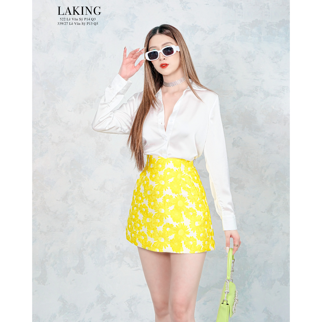 Áo vest họa tiết hoa vàng phối váy cùng tone Laking House