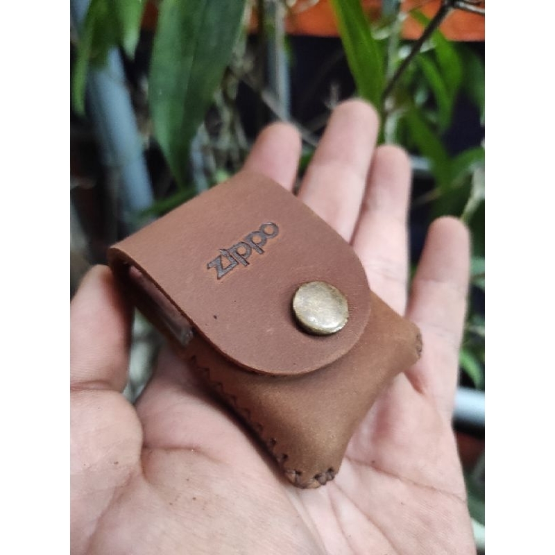 Bao da cầm tay zippo