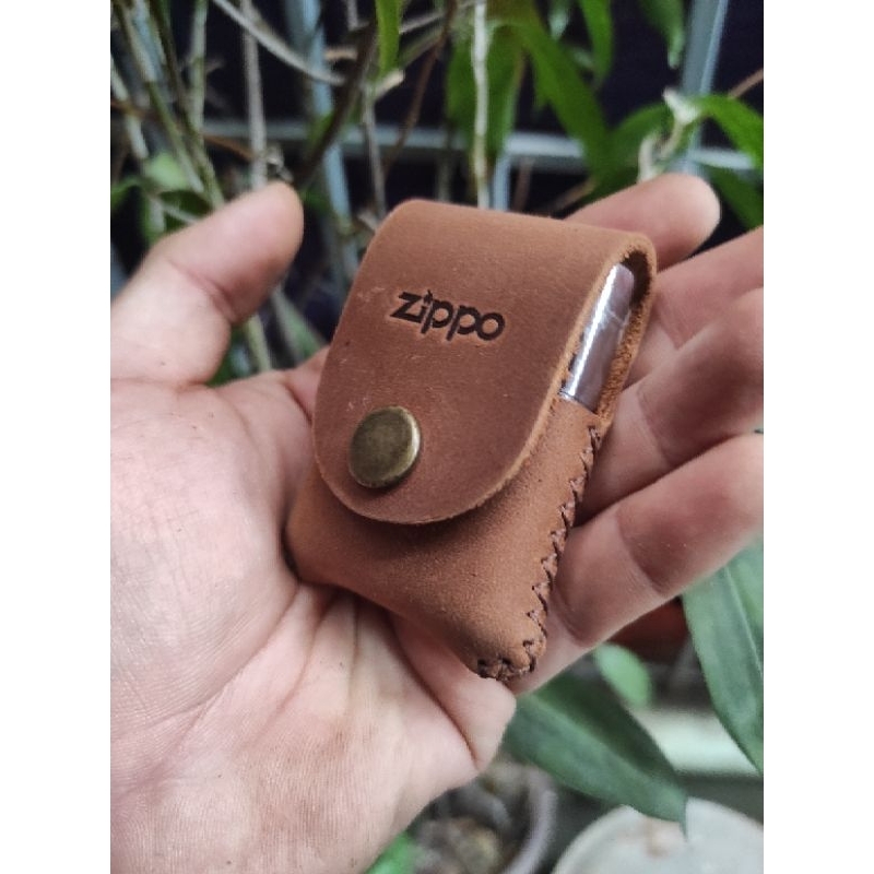 Bao da cầm tay zippo