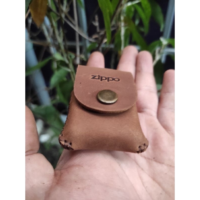 Bao da cầm tay zippo