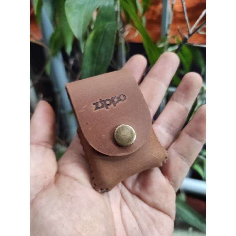 Bao da cầm tay zippo