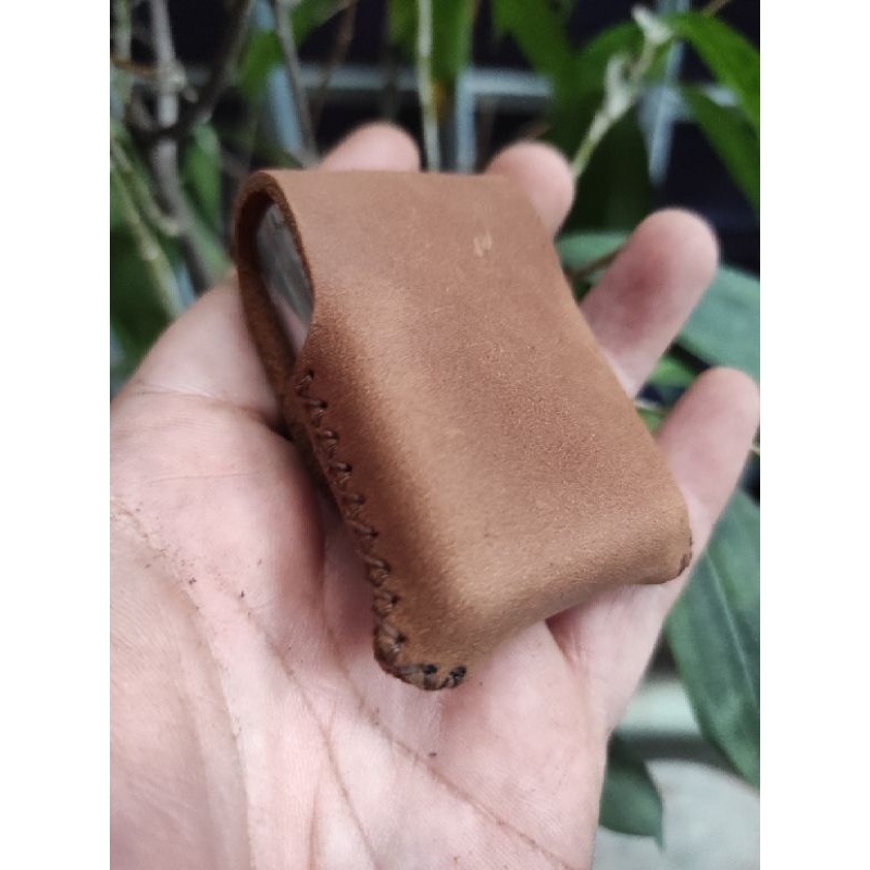 Bao da cầm tay zippo