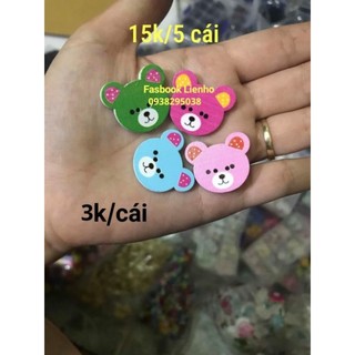 Nút gỗ hình thú và hoa văn