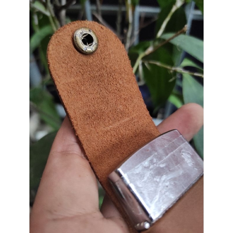 Bao da cầm tay zippo