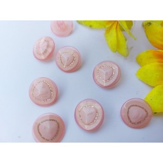 Nút áo màu hồng nhạt có kim tuyến lấp lánh