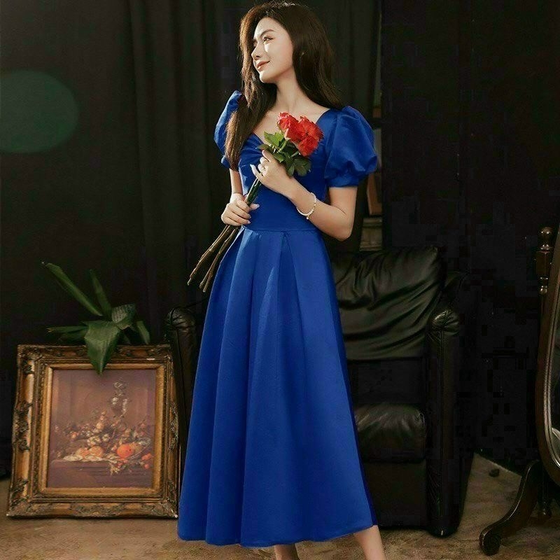Đầm xòe công sở dự tiệc, cổ tứ giác, tay ngắn phồng, nơ trước ngực, tùng xòe xếp li, dây kéo sau lưng
