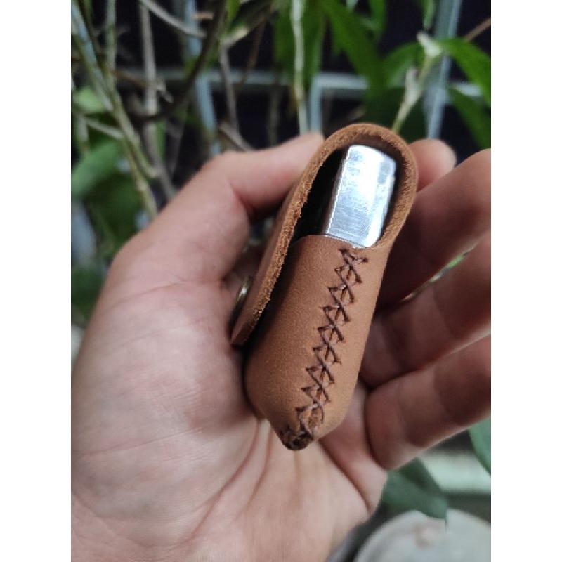 Bao da cầm tay zippo