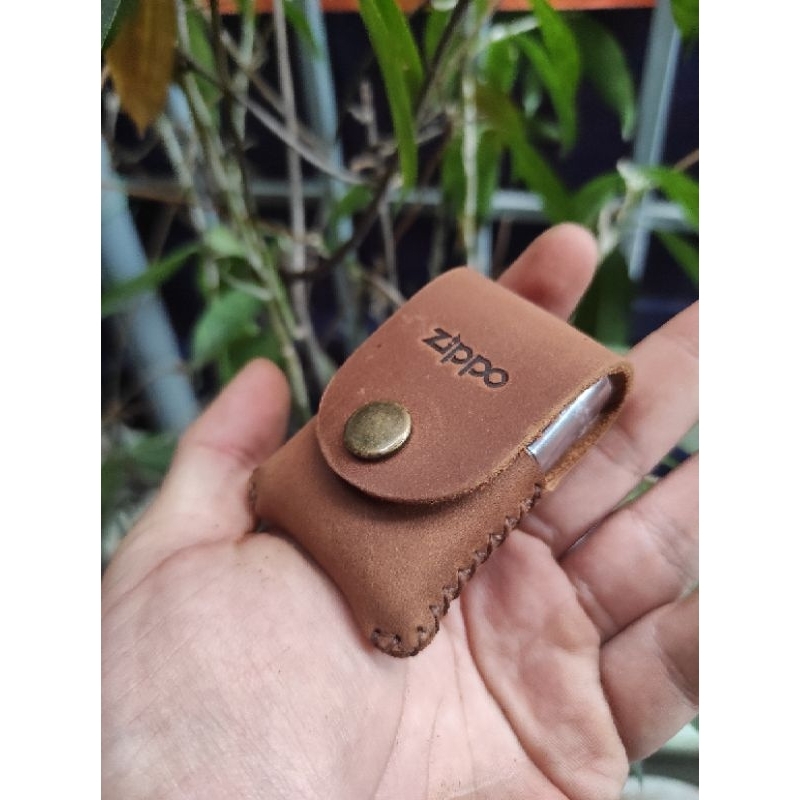 Bao da cầm tay zippo