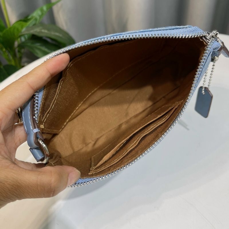 Túi Coac*h Nolita 19 kẹp nách sang trọng