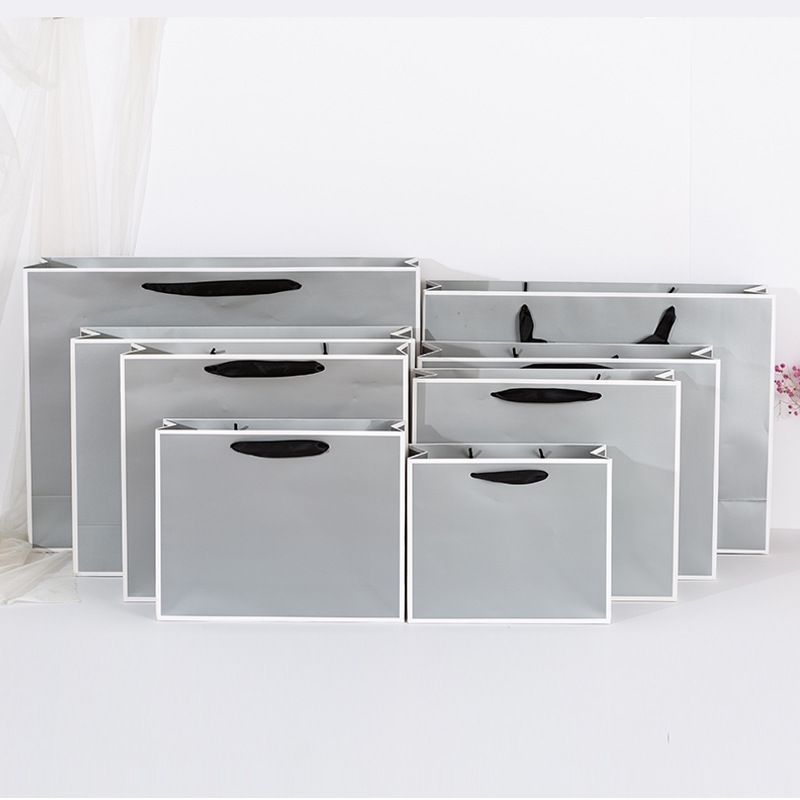 Túi giấy đựng quần áo, đựng mỹ phẩm có quai sang trọng cứng cáp chất liệu giấy Cocher