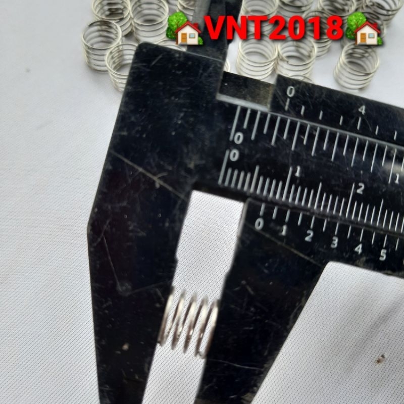 Lò xo nén inox phi 9x7mm