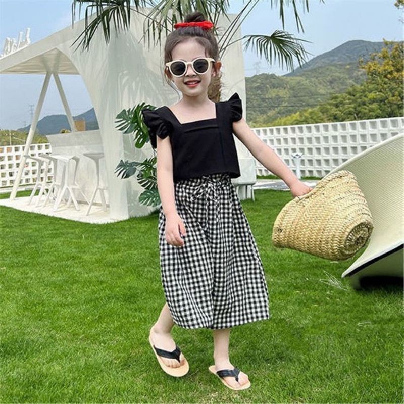 Bộ  áo cánh tiên nơ lưng kèm quần xuông caro tiểu thư bé gái