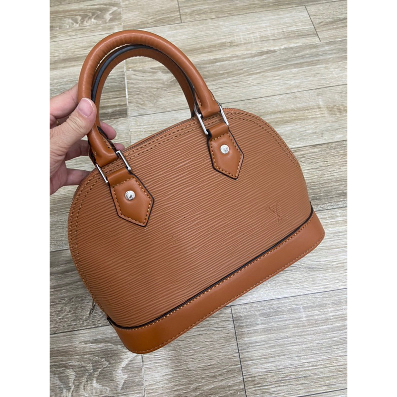 Túi si da tăm LV hến